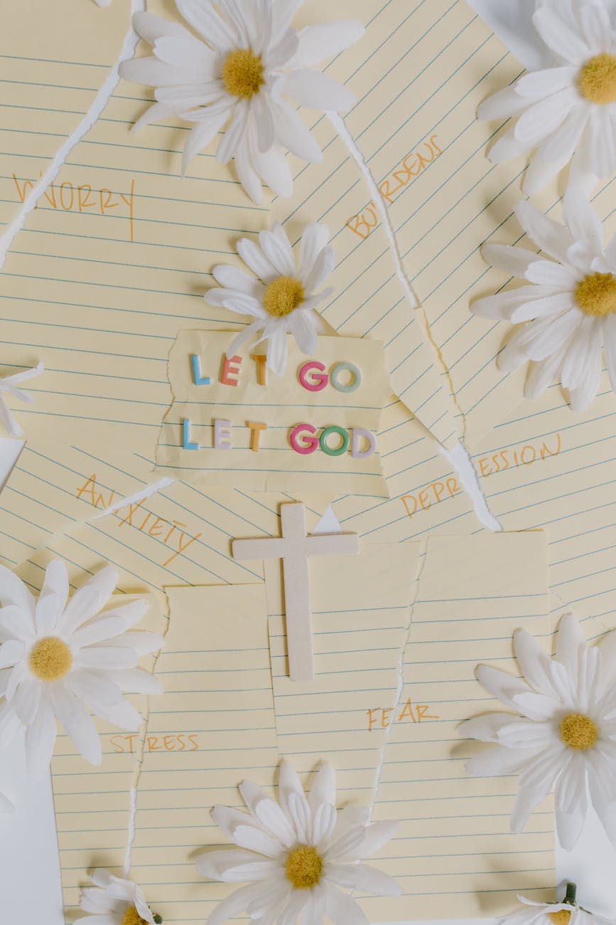 Image of flowers on notebook paper that says "Let Go, Let God"